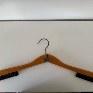 Antique folding suit hanger with brush